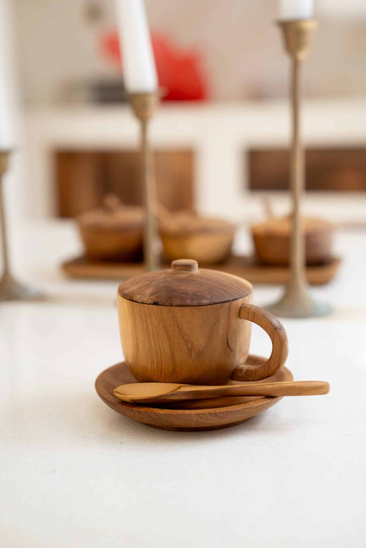 Wooden cup with lit and spoon
