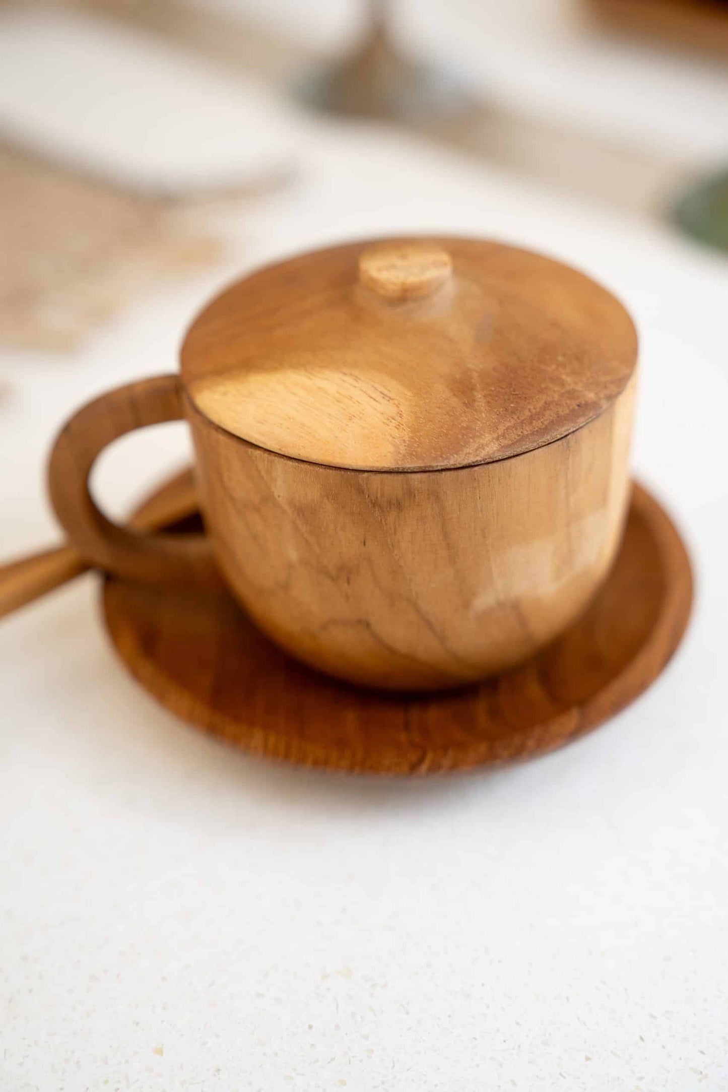 Wooden cup with lit and spoon