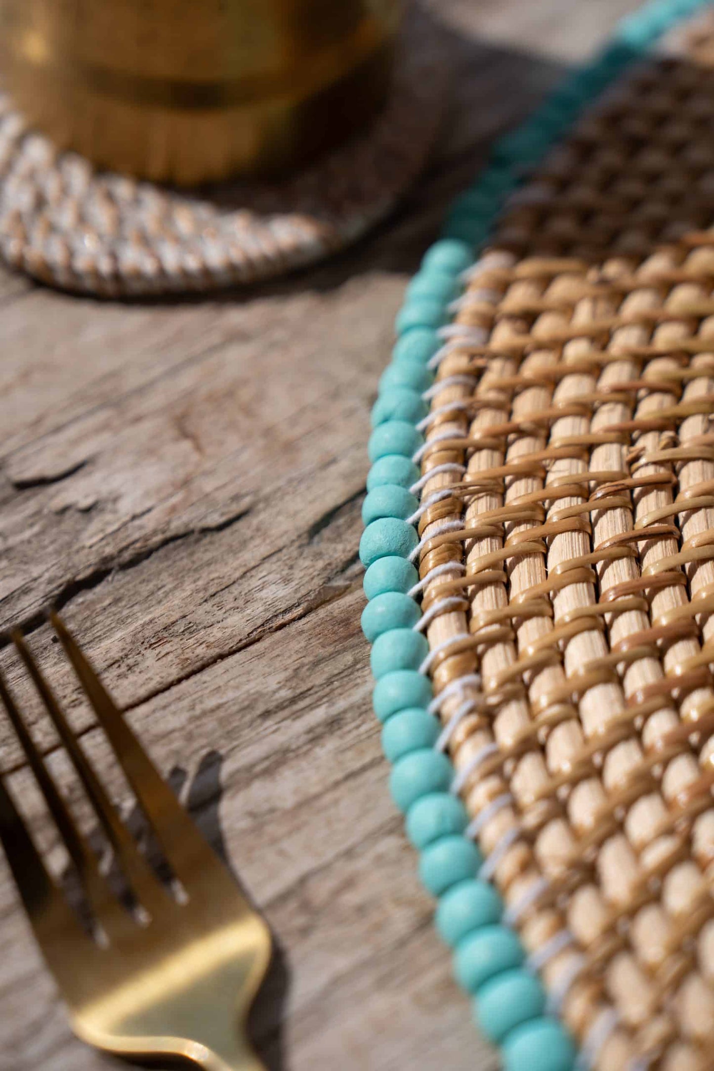 Rattan placemat with blue beads