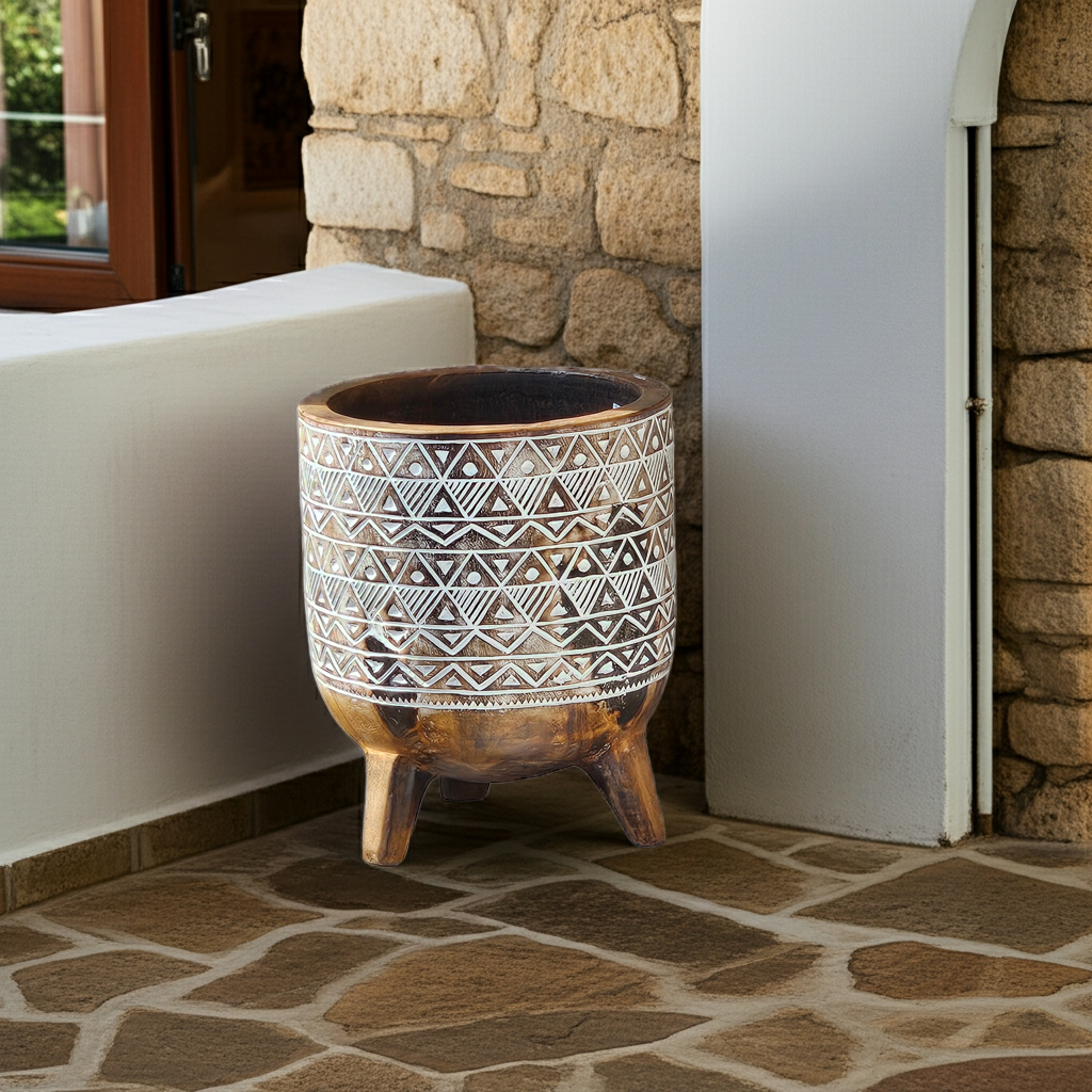 Beautiful decorated pot on three legs. Model Piring