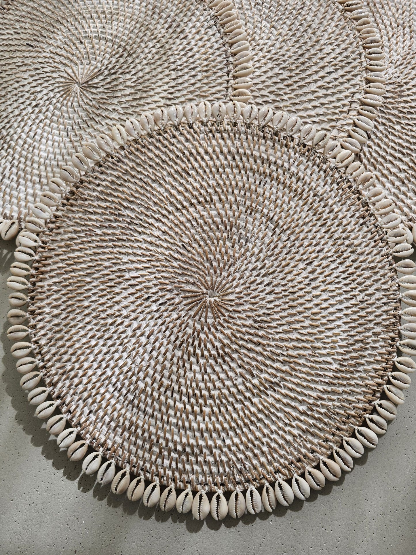 Ratan placemat decorated with shells