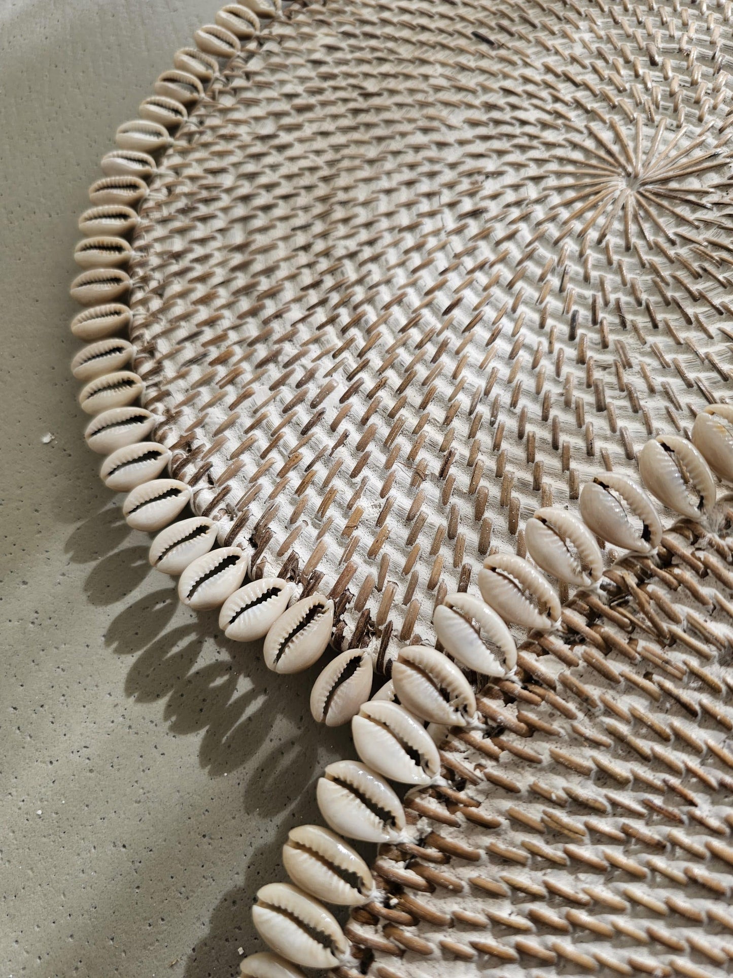 Ratan placemat decorated with shells