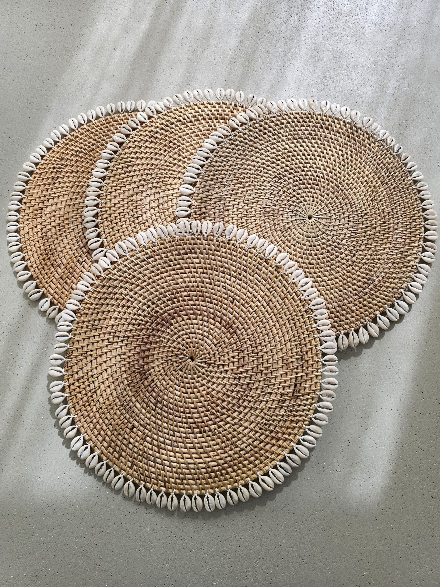 Ratan placemat decorated with shells