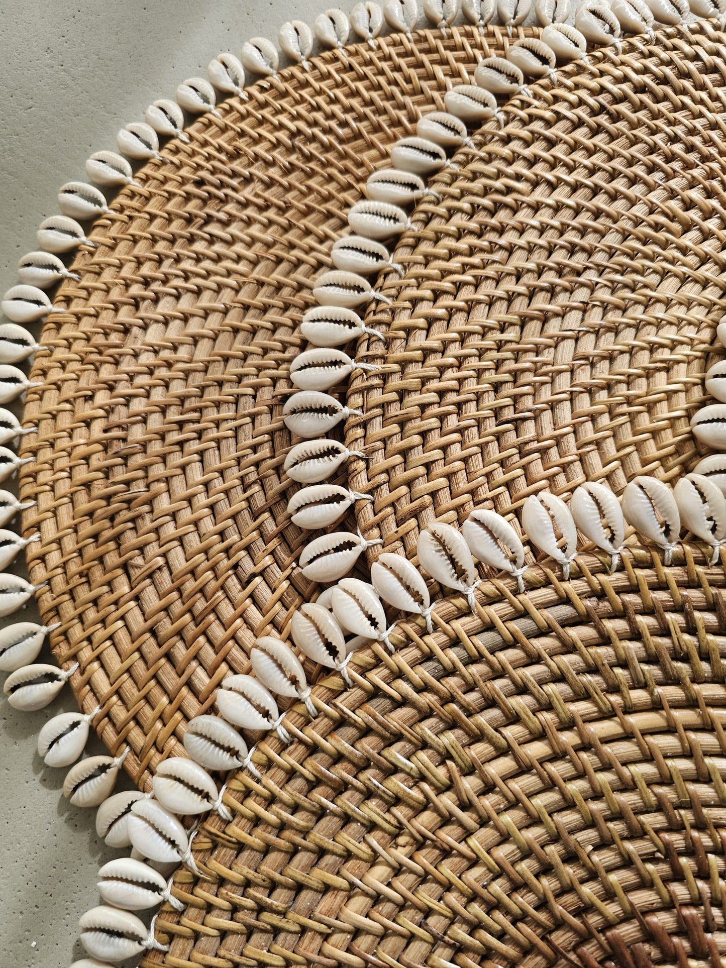 Ratan placemat decorated with shells