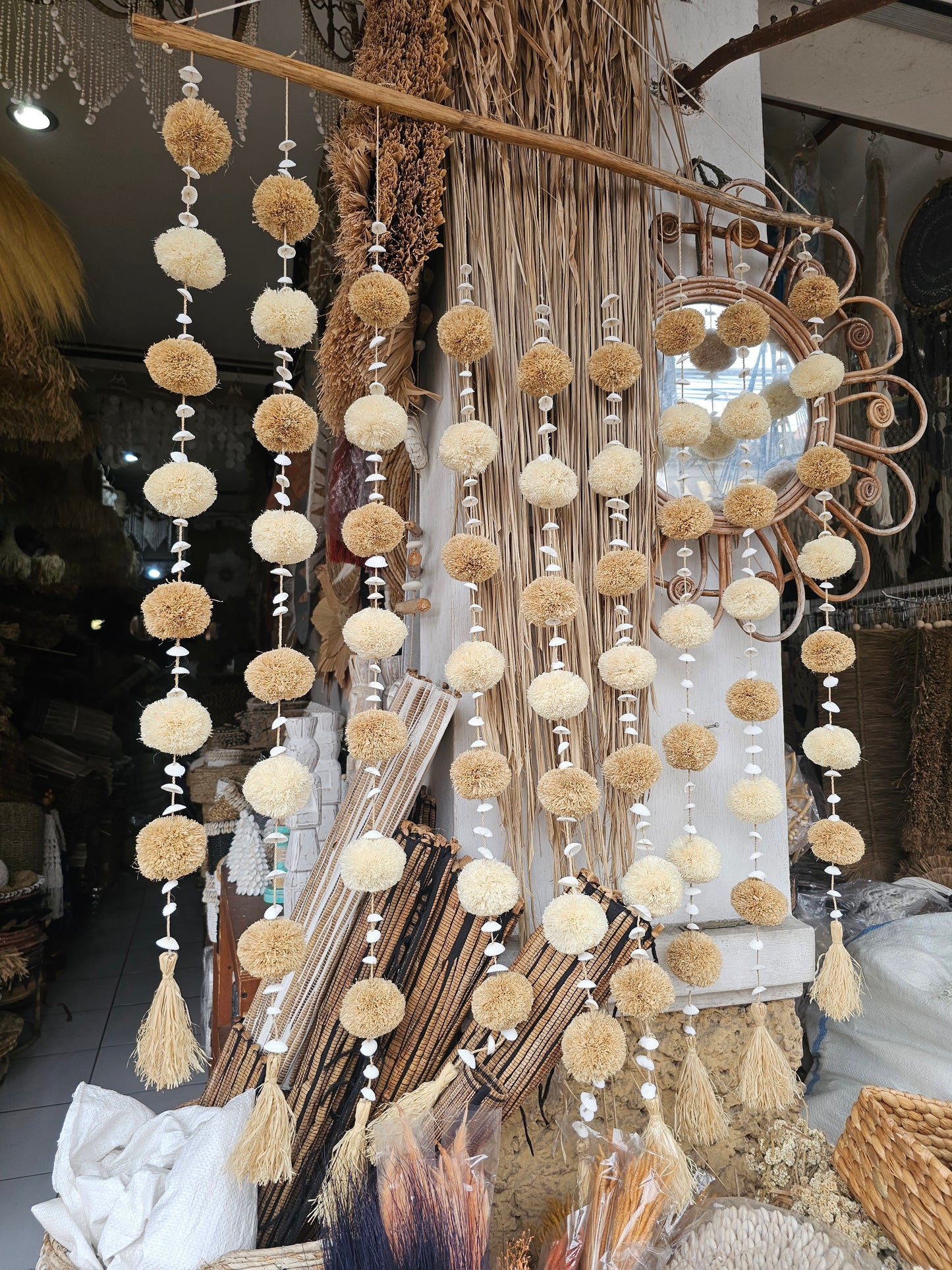 Curtain pompom tassels on a stick