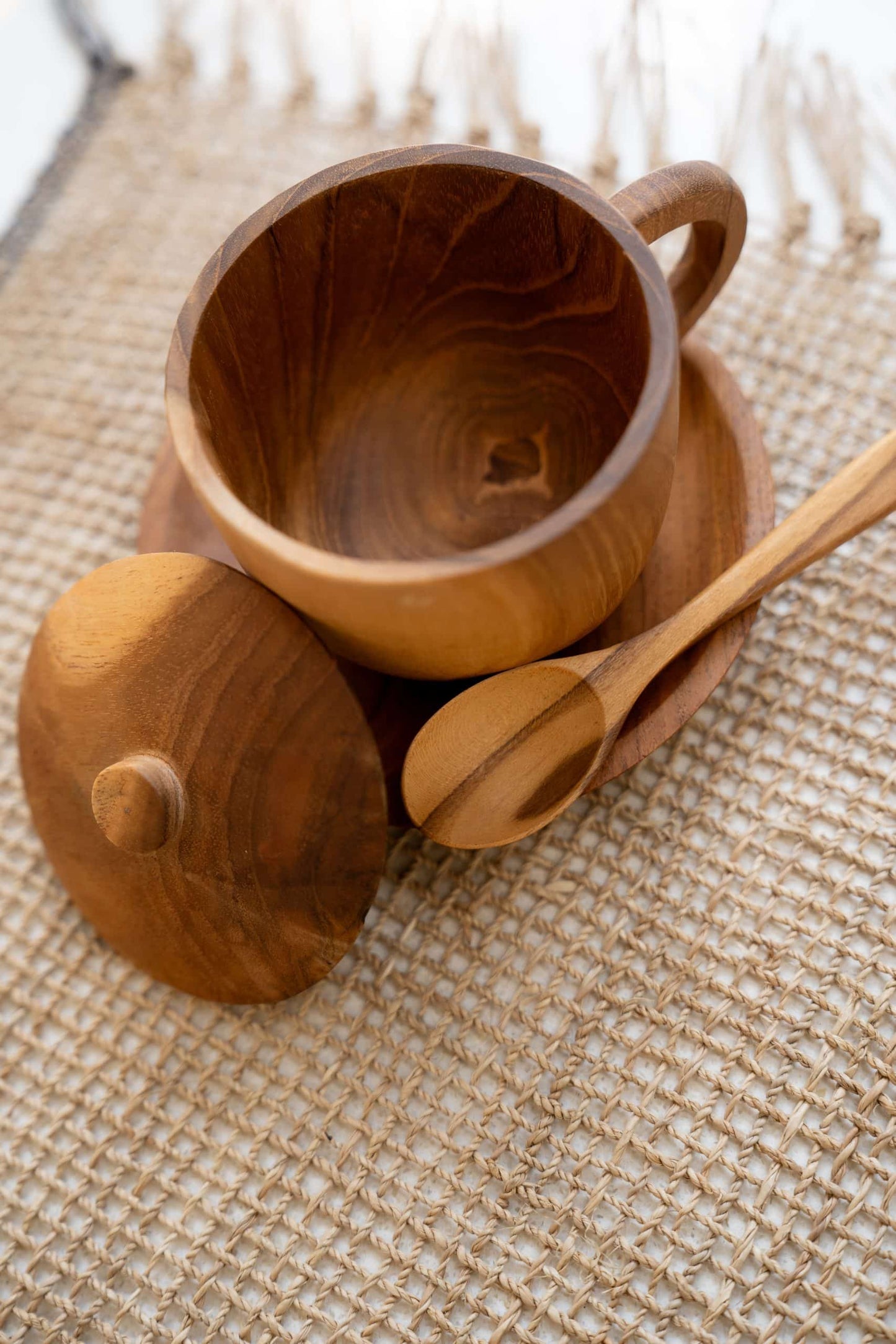 Wooden cup with lit and spoon