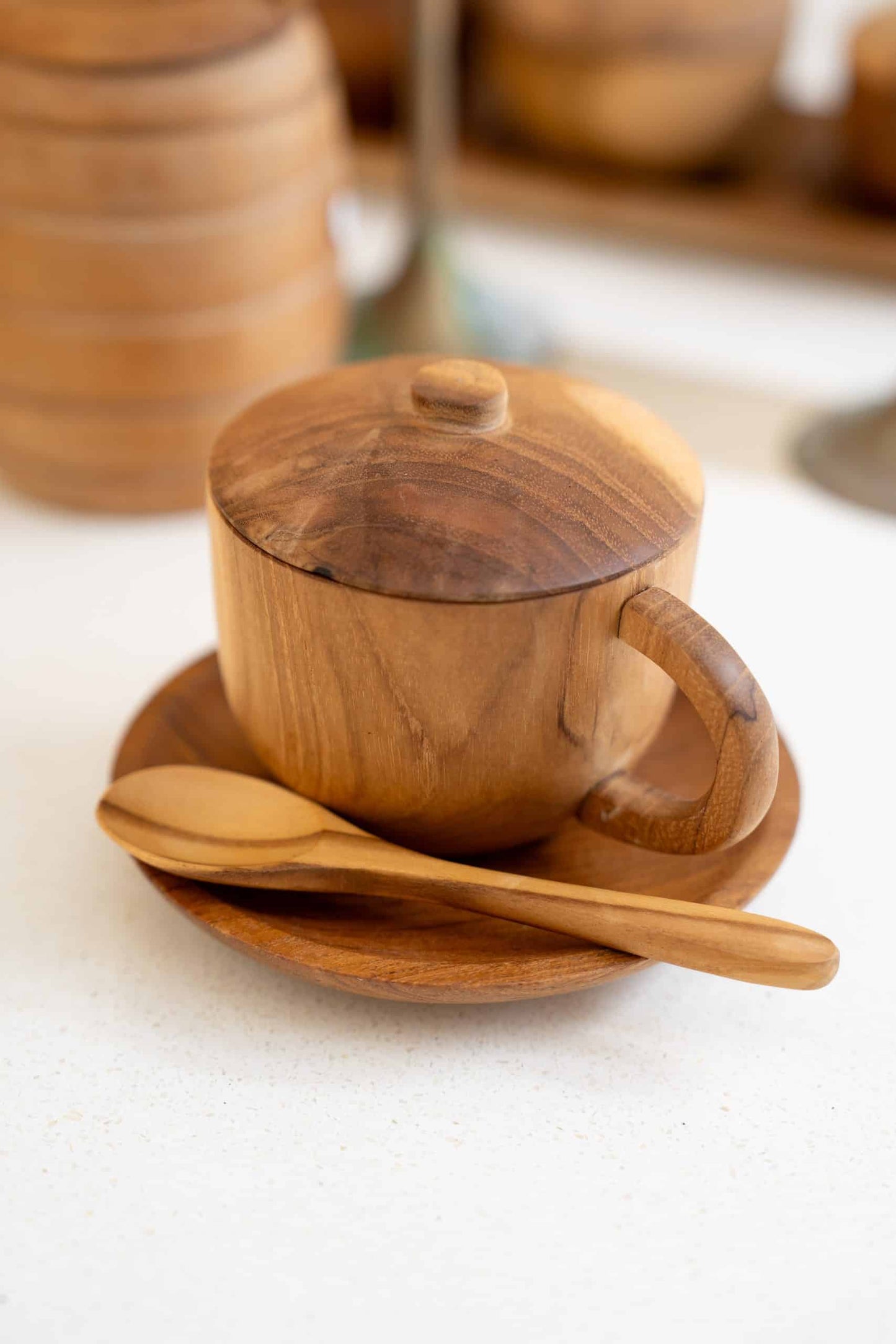 Wooden cup with lit and spoon