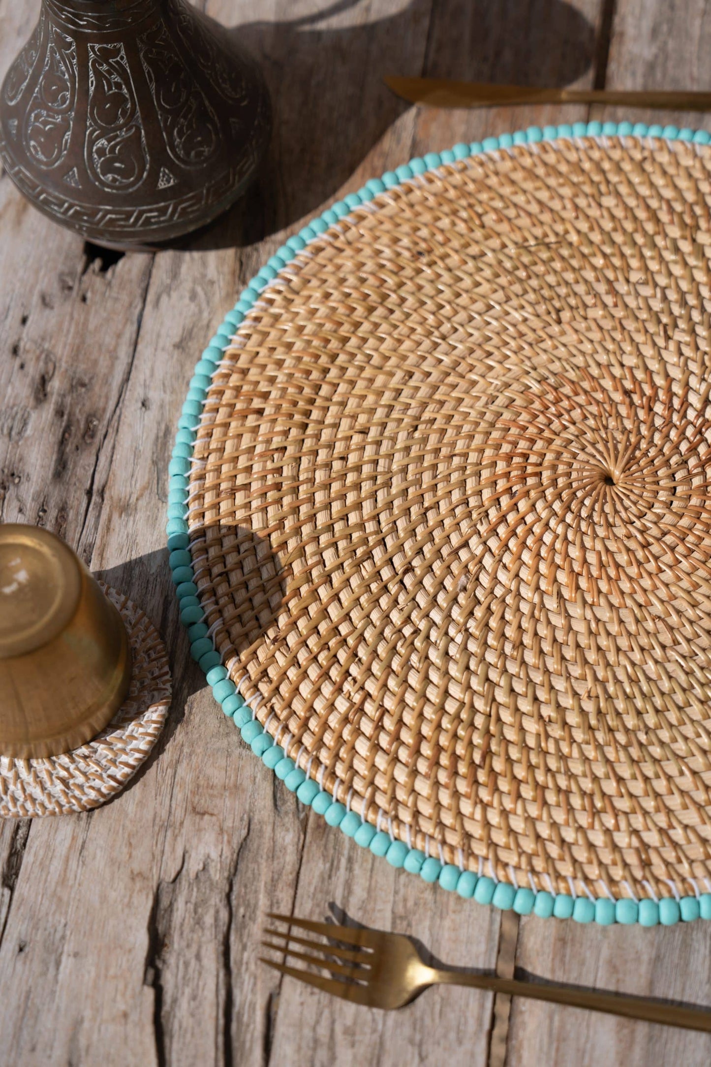 Rattan placemat with blue beads