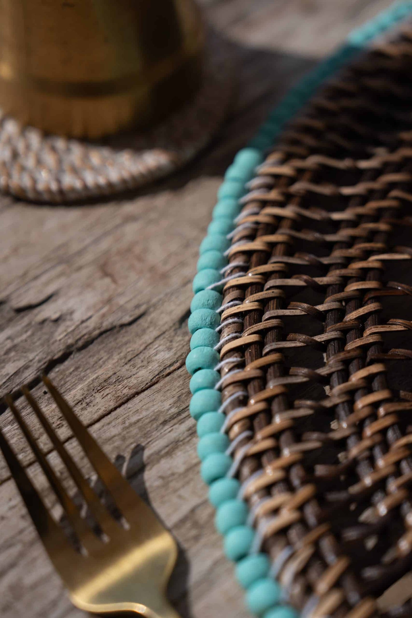 Rattan placemat with blue beads